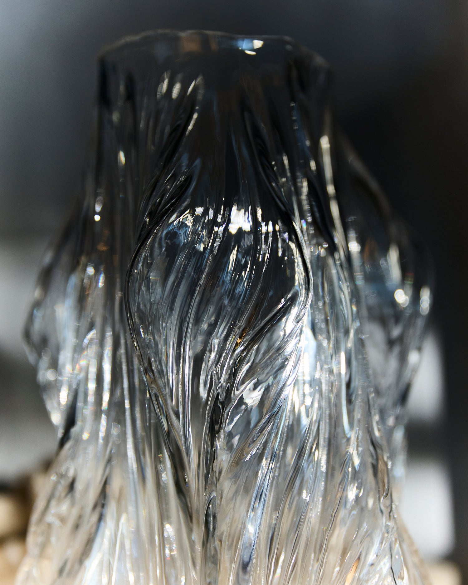 Close-up of a crystal with intricate patterns on a dark background